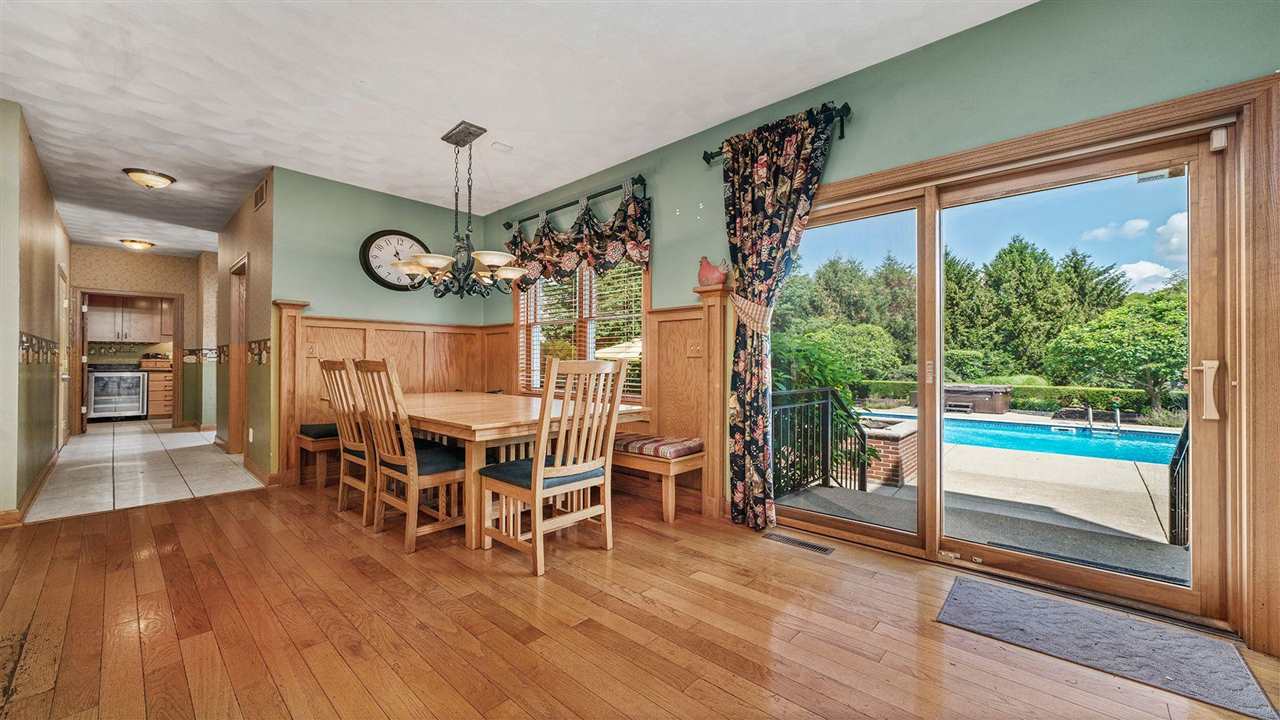 4464 Ridgeview Lane Byron, IL 61010 - Photo 10 of 54 a view of a dining room with furniture window and wooden floor