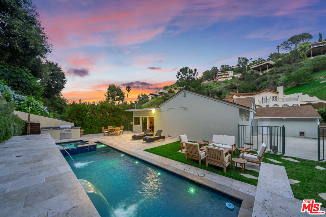 3771 Longview Valley Road Sherman Oaks, CA 91423 - Photo 18 of 75 a view of a house with pool and chairs