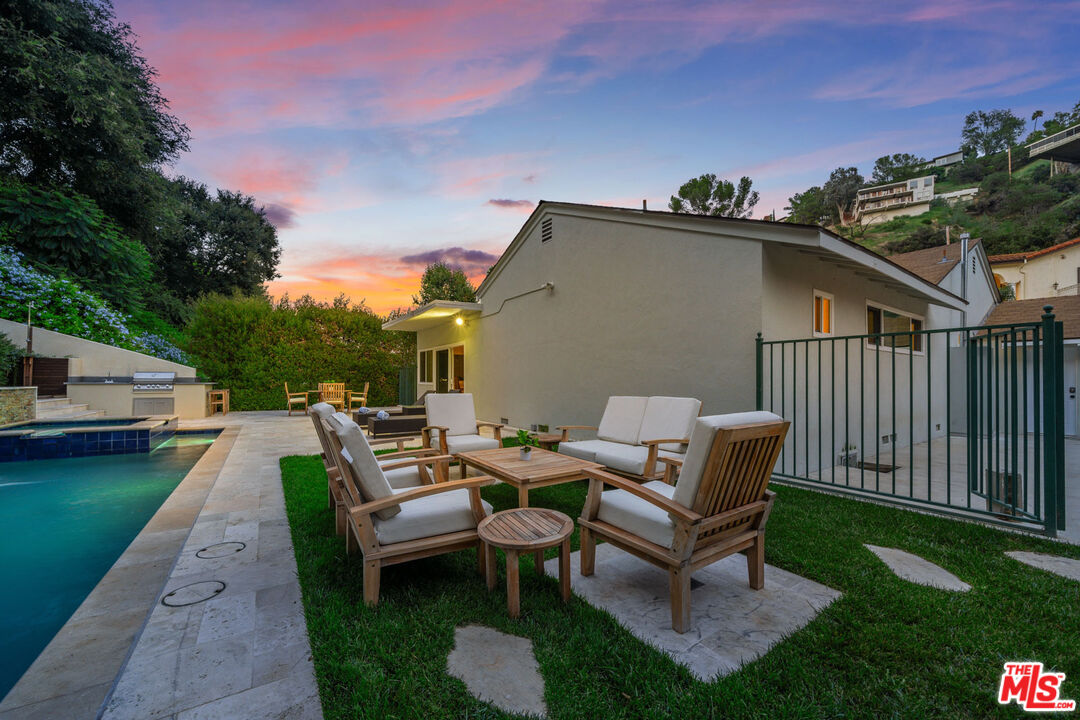 3771 Longview Valley Road Sherman Oaks, CA 91423 - Photo 20 of 75 a backyard of a house with table and chairs