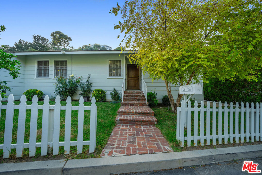 3771 Longview Valley Road Sherman Oaks, CA 91423 - Photo 26 of 75 a front view of white house with a garden