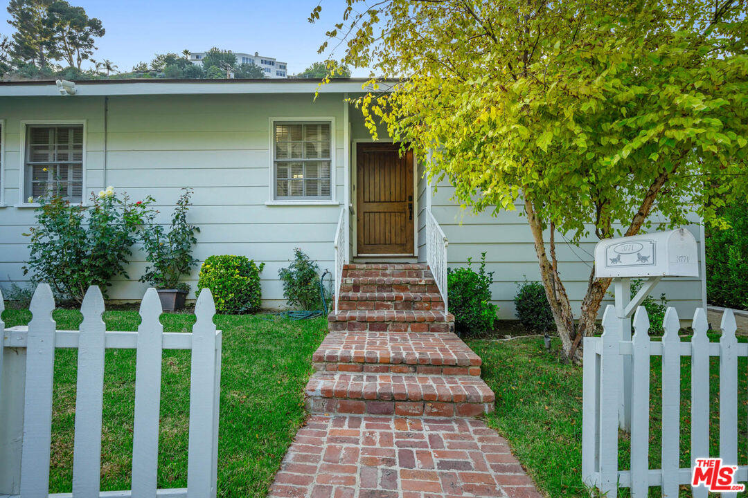 3771 Longview Valley Road Sherman Oaks, CA 91423 - Photo 27 of 75 a front view of a house with a yard