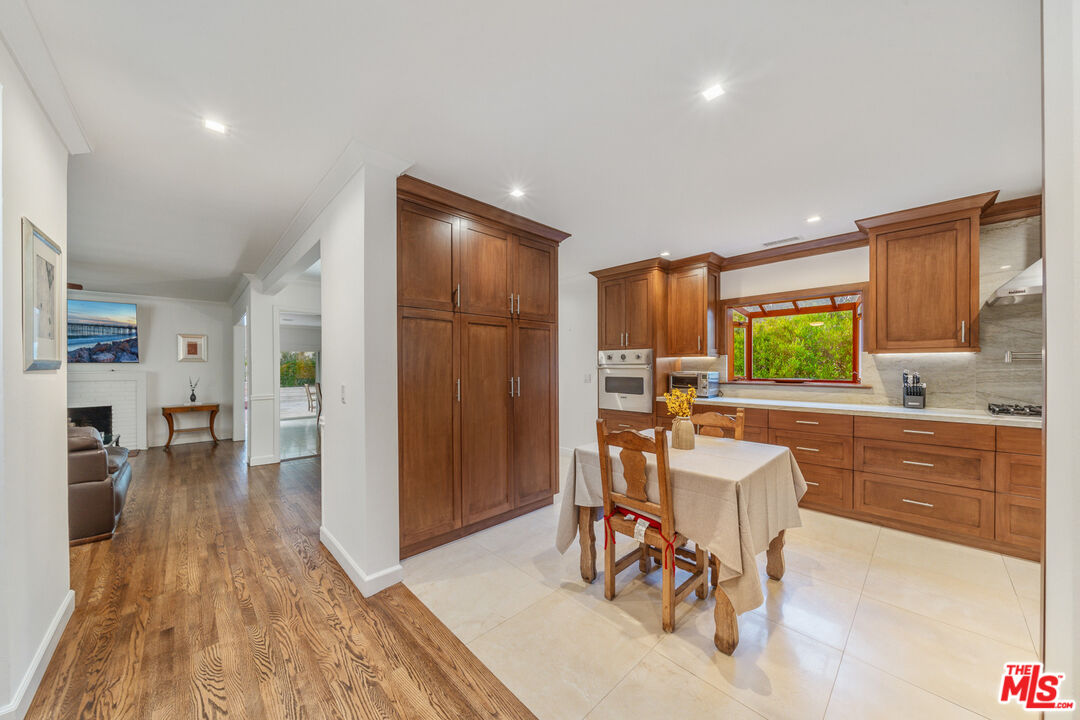 3771 Longview Valley Road Sherman Oaks, CA 91423 - Photo 33 of 75 a view of a dining room with furniture window and wooden floor