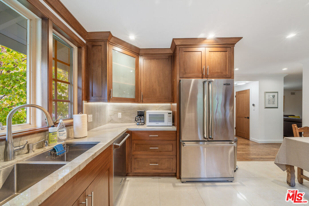 3771 Longview Valley Road Sherman Oaks, CA 91423 - Photo 39 of 75 a kitchen with a refrigerator and a sink