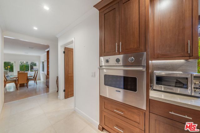 a bedroom with a bed and chair