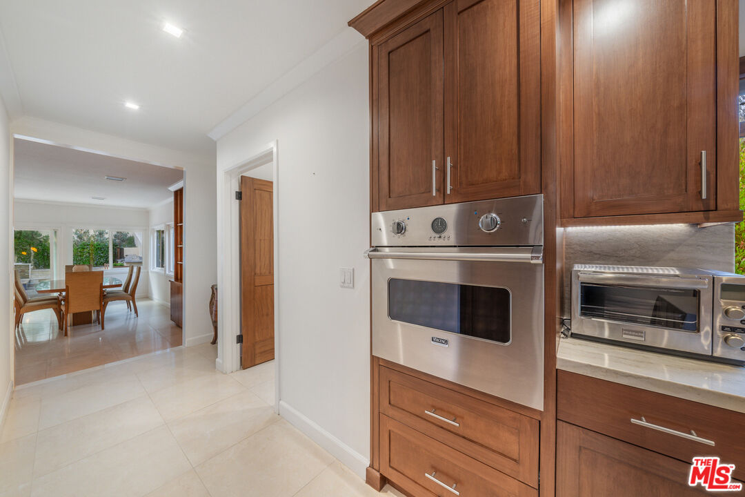 3771 Longview Valley Road Sherman Oaks, CA 91423 - Photo 43 of 75 a kitchen with a stove and a microwave