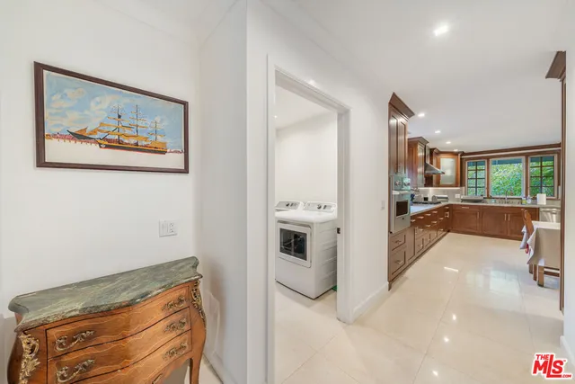 a bedroom with a bed and a large mirror