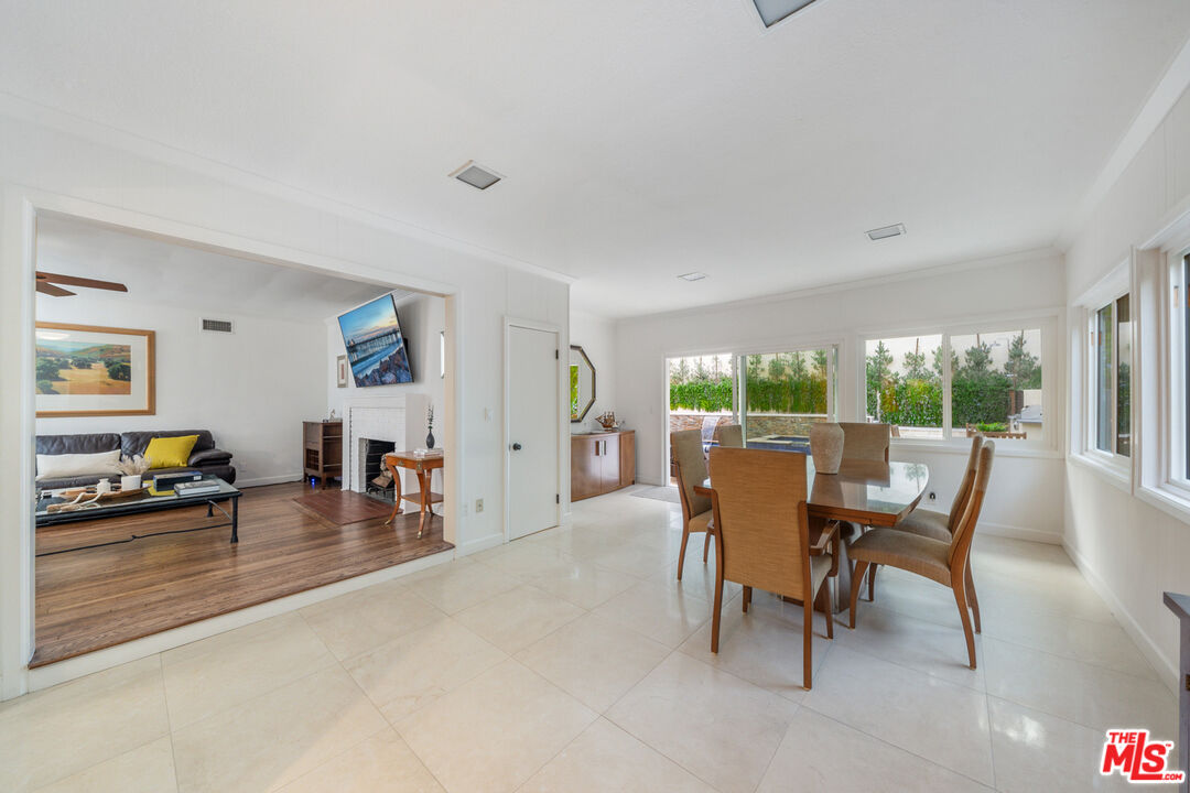 3771 Longview Valley Road Sherman Oaks, CA 91423 - Photo 48 of 75 a dining room with furniture and wooden floor