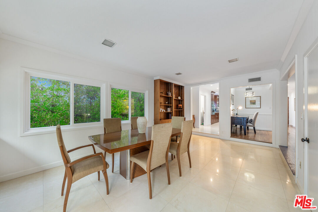 3771 Longview Valley Road Sherman Oaks, CA 91423 - Photo 50 of 75 a dining room with furniture and large windows