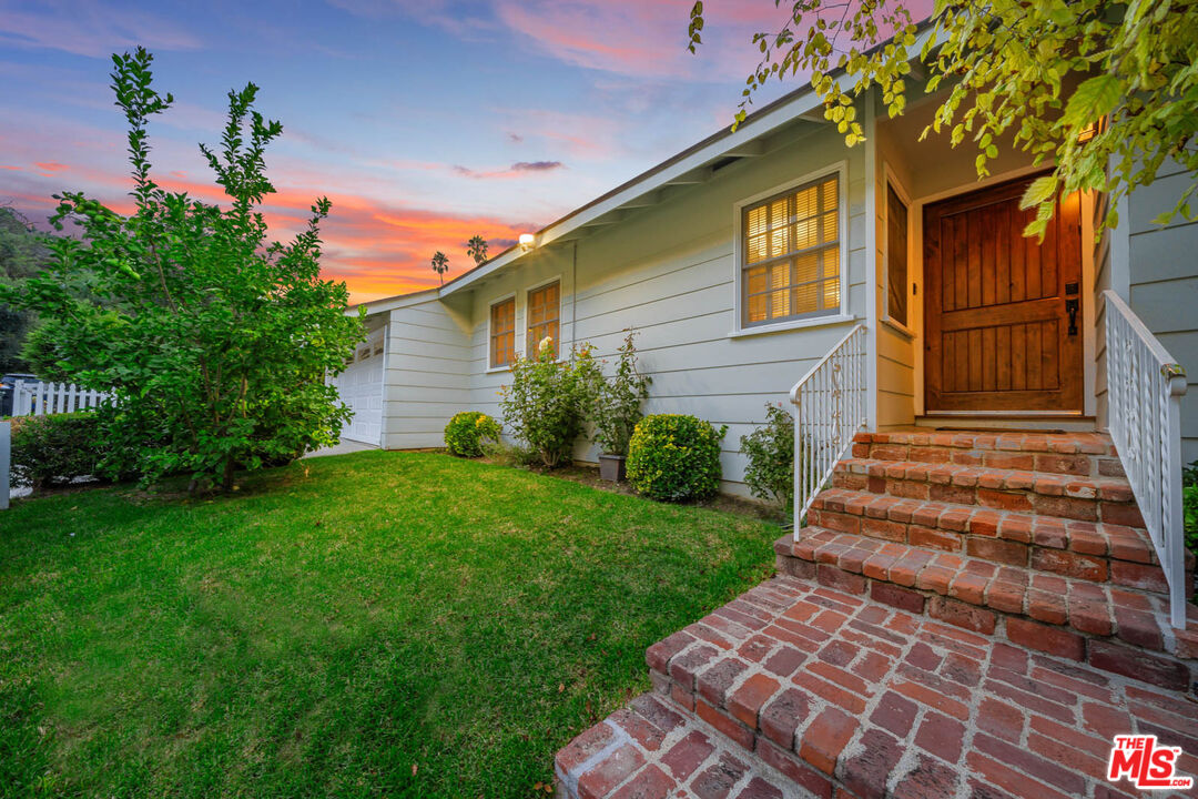 3771 Longview Valley Road Sherman Oaks, CA 91423 - Photo 5 of 75 a front view of a house with a yard