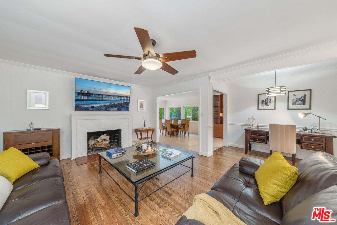 3771 Longview Valley Road Sherman Oaks, CA 91423 - Photo 58 of 75 a living room with furniture and a fireplace
