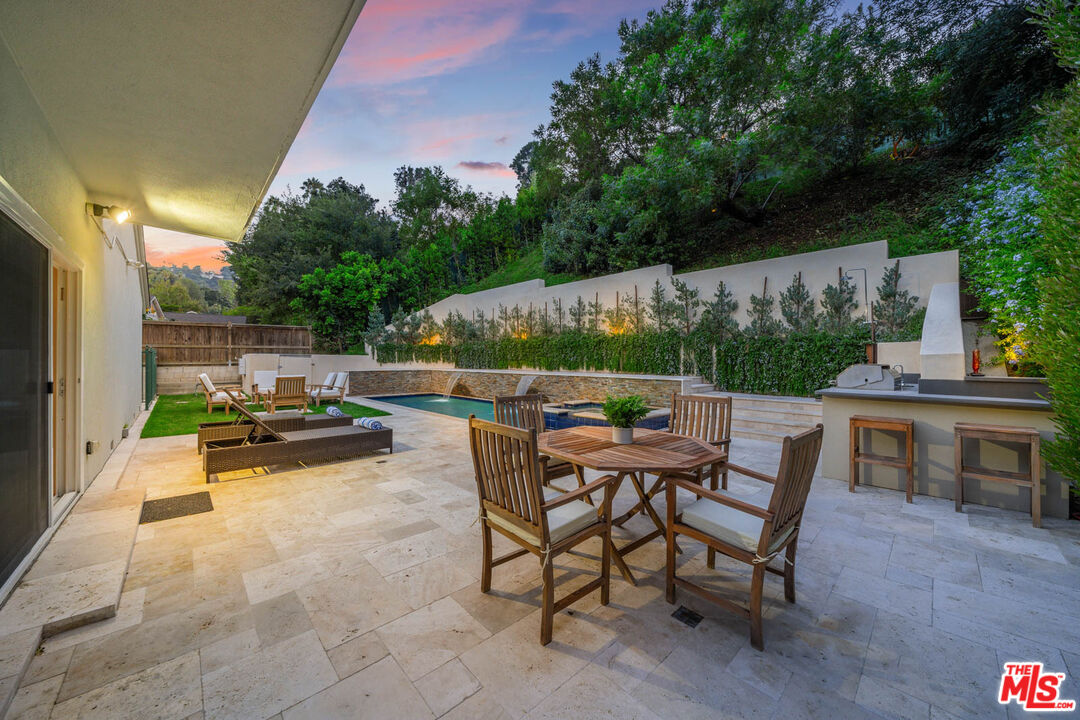 3771 Longview Valley Road Sherman Oaks, CA 91423 - Photo 6 of 75 a view of backyard with seating area and green space