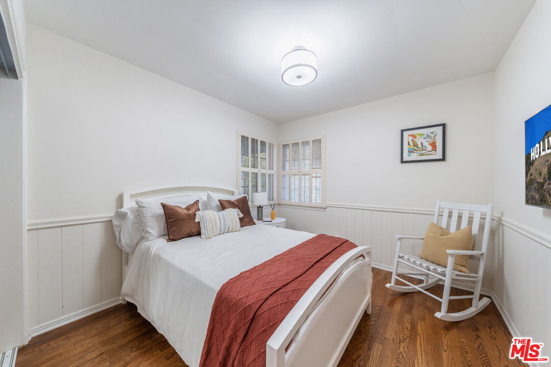 3771 Longview Valley Road Sherman Oaks, CA 91423 - Photo 65 of 75 a bed room with a bed and a chair