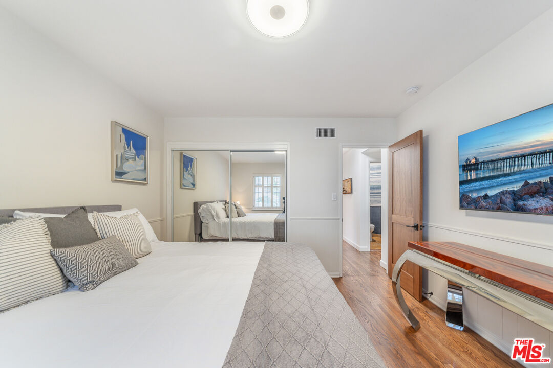 3771 Longview Valley Road Sherman Oaks, CA 91423 - Photo 70 of 75 a bed room with a bed and a couch