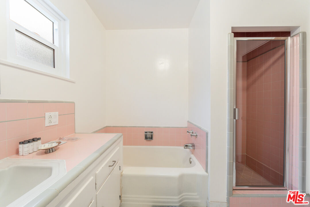 3771 Longview Valley Road Sherman Oaks, CA 91423 - Photo 75 of 75 a bathroom with a sink and a bathtub