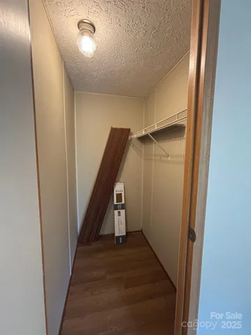 a view of a hallway with staircase