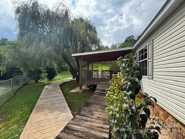 a backyard of a house with lots of green space