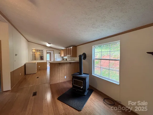 a living room with furniture window and a flat screen tv