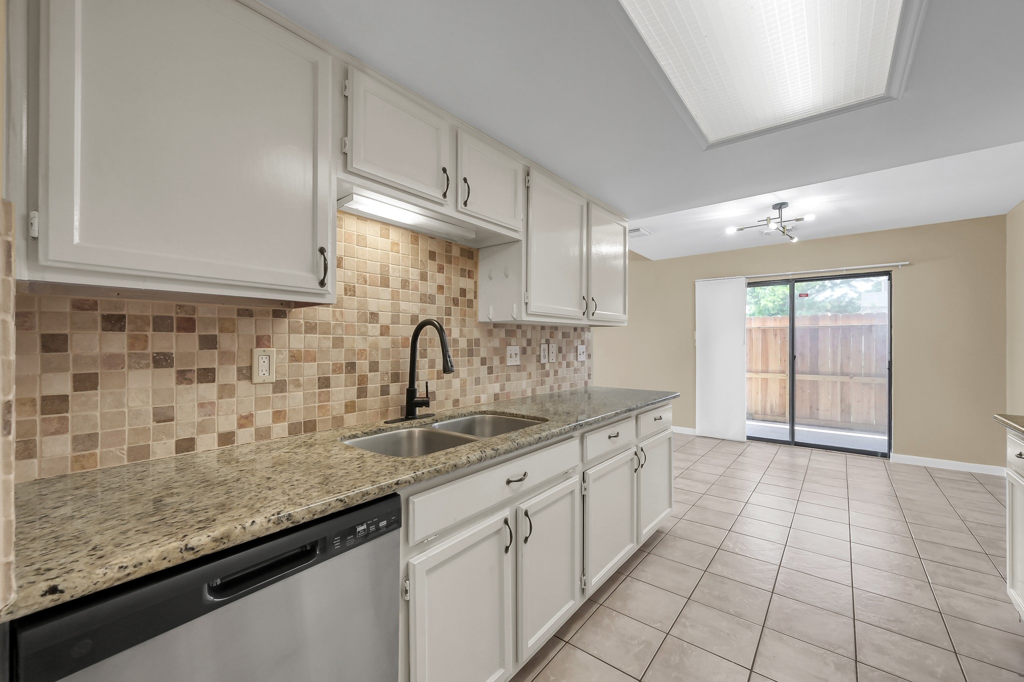 16906 Timberwork Road Spring, TX 77379 - Photo 15 of 36 a kitchen with a sink and cabinets