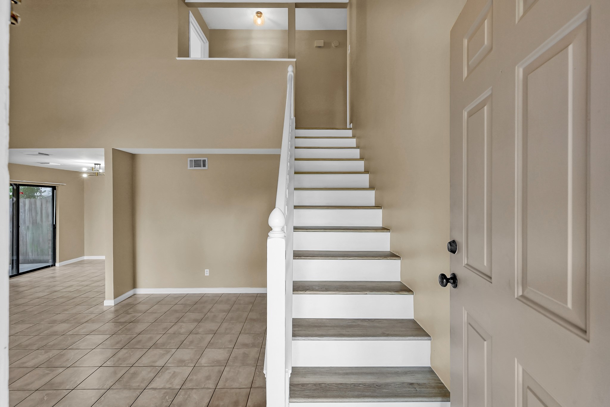 16906 Timberwork Road Spring, TX 77379 - Photo 18 of 36 a view of an entryway with staircase