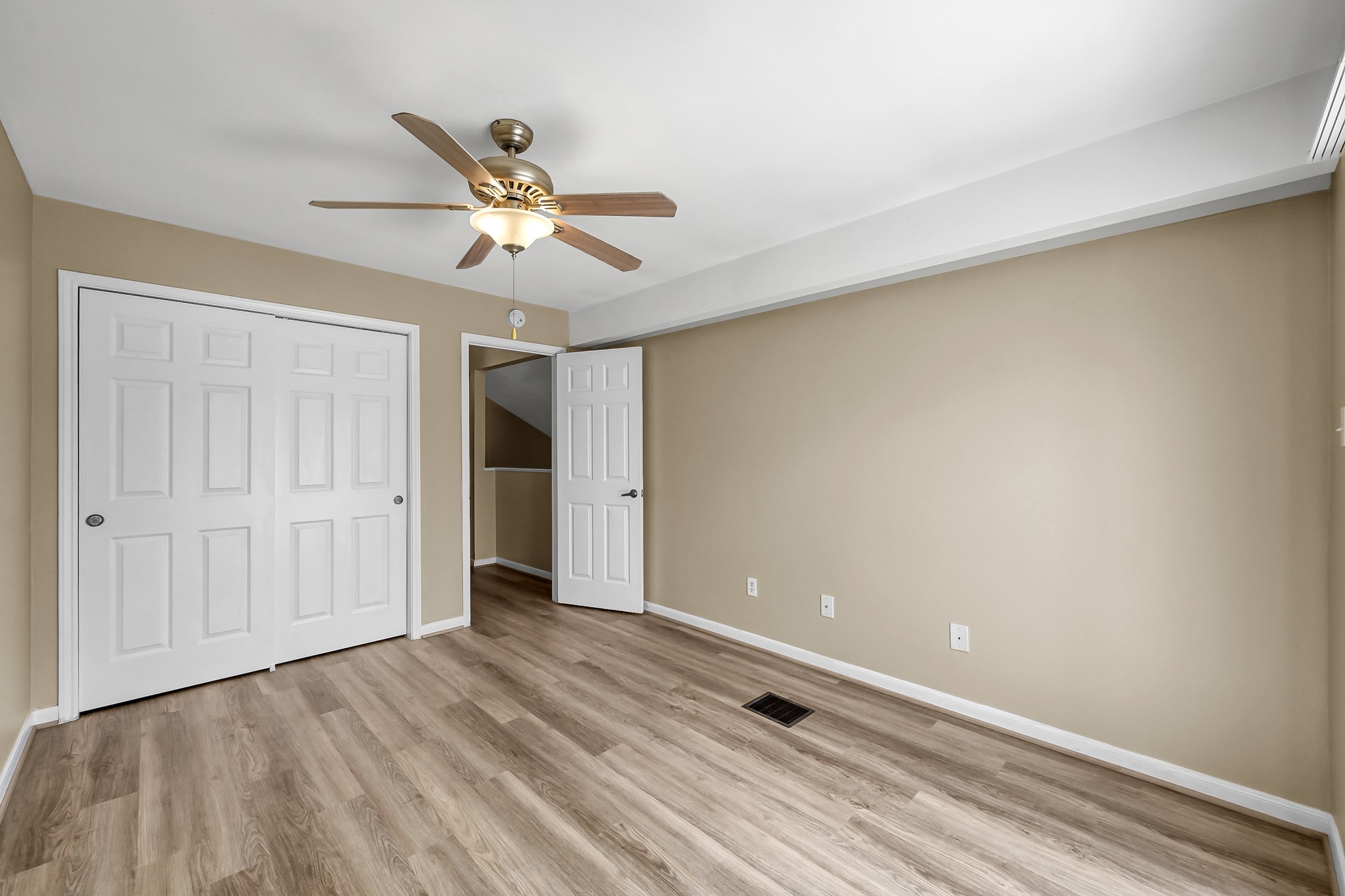 16906 Timberwork Road Spring, TX 77379 - Photo 28 of 36 a view of an empty room and window with a ceiling fan