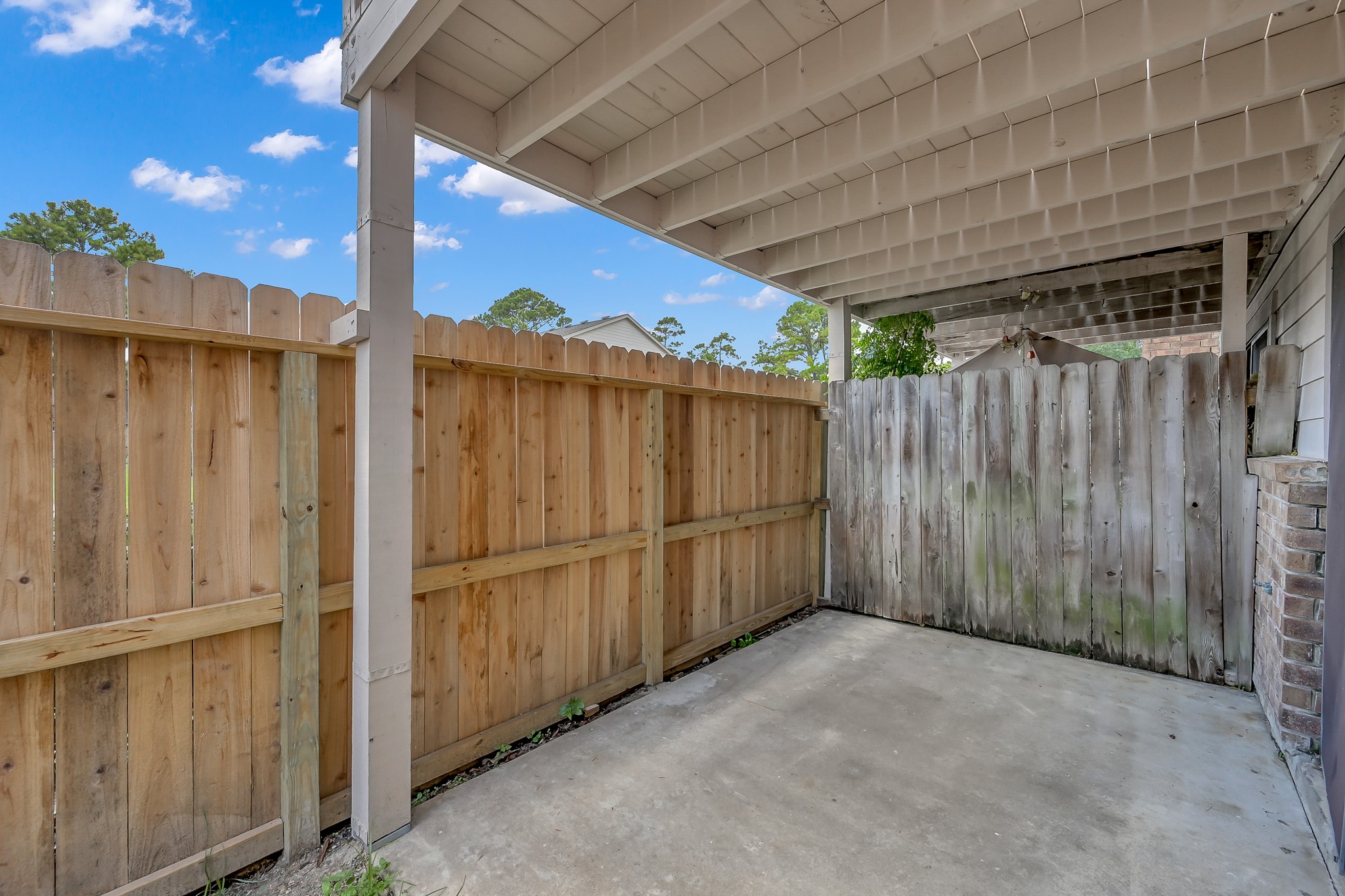 16906 Timberwork Road Spring, TX 77379 - Photo 30 of 36 a view of a backyard with wooden fence