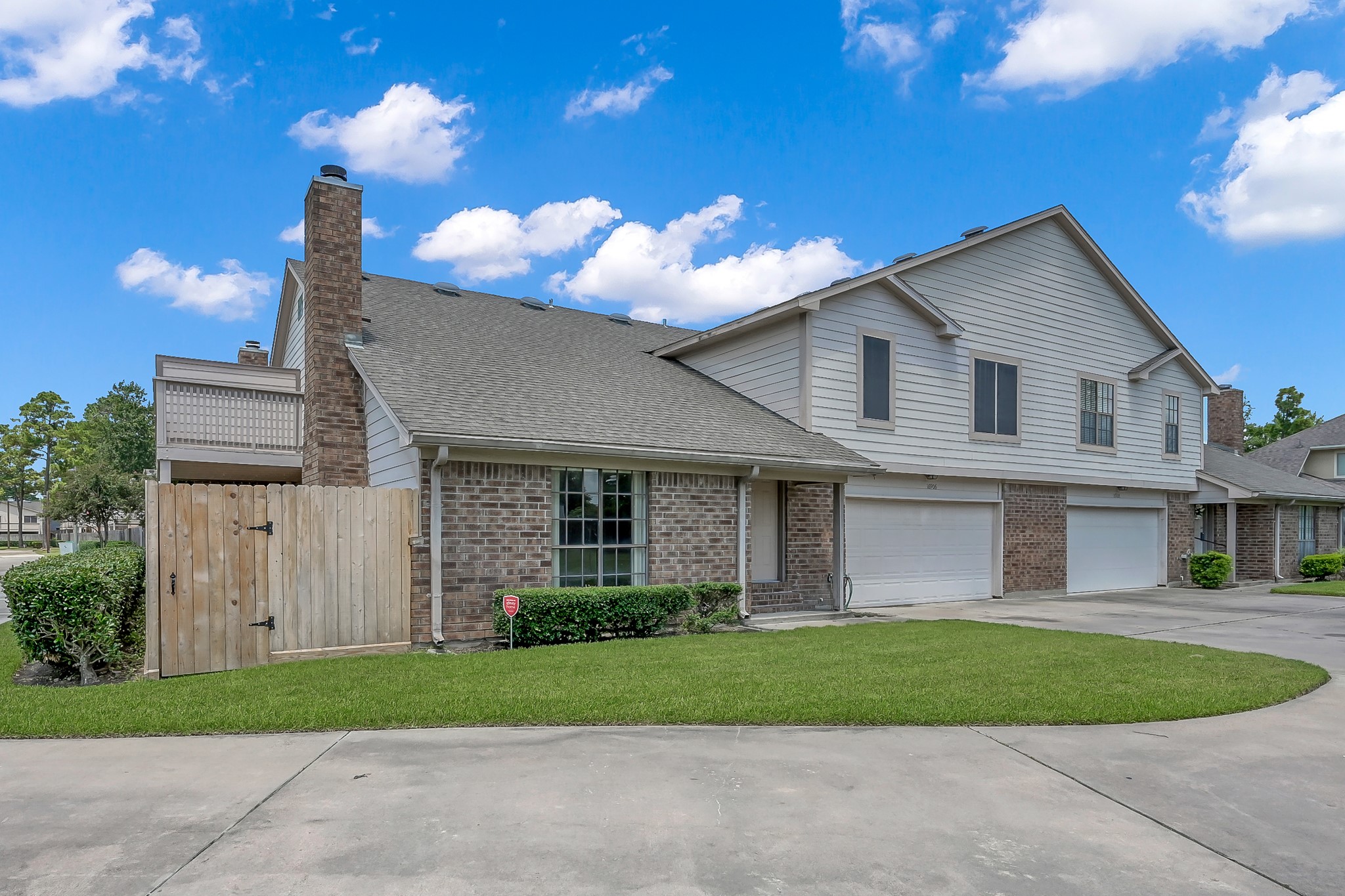 16906 Timberwork Road Spring, TX 77379 - Photo 32 of 36 a front view of a house with a garden and plants