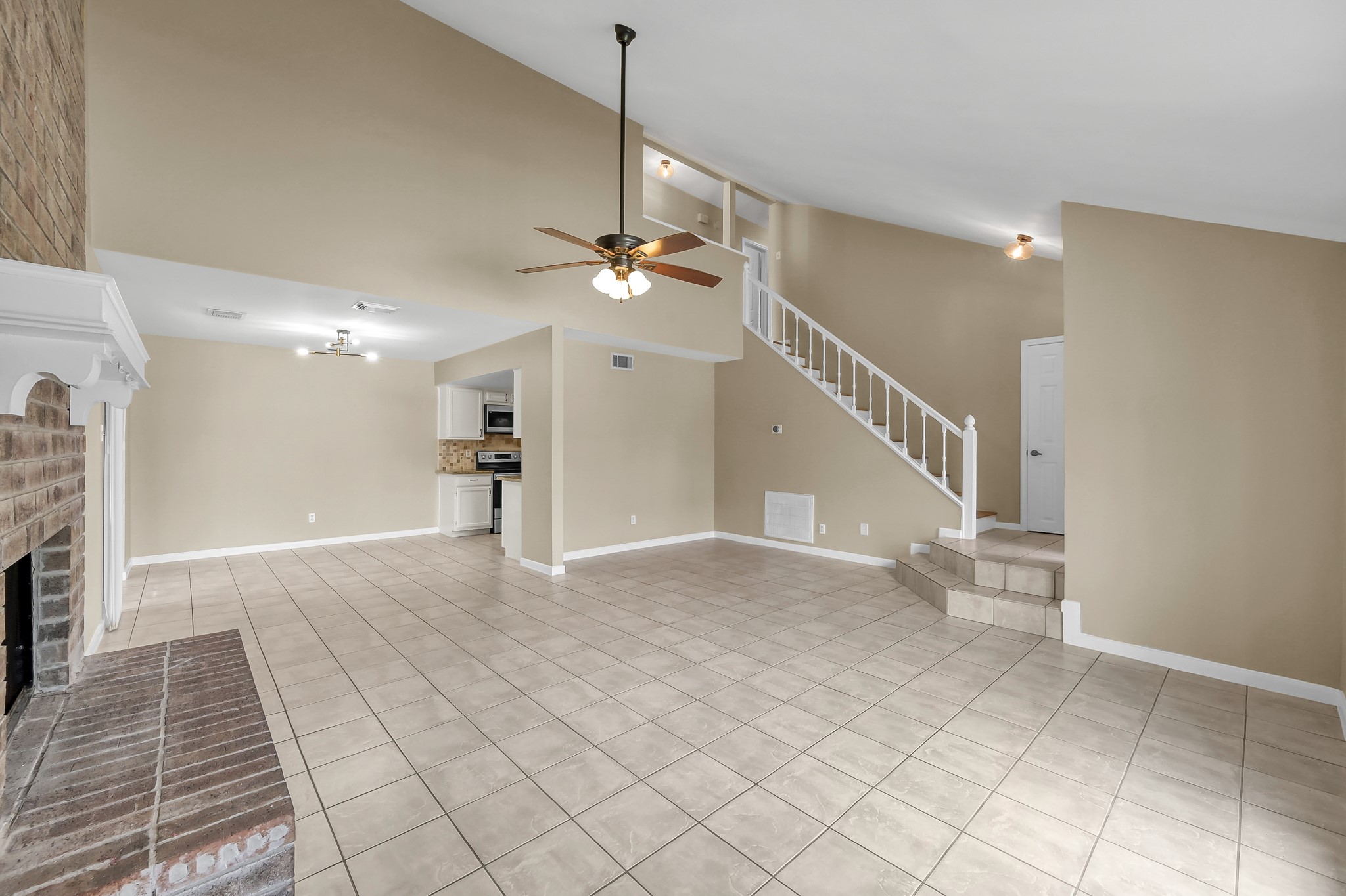 16906 Timberwork Road Spring, TX 77379 - Photo 5 of 36 a view of a livingroom with a staircase