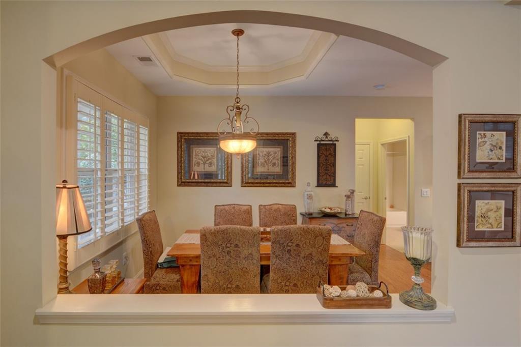 910 Brook Knoll Lane Cumming, GA 30041 - Photo 13 of 36 a living room with large mirror and furniture
