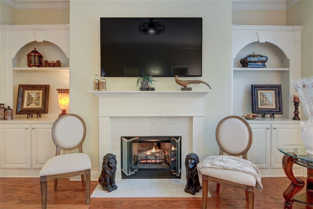 910 Brook Knoll Lane Cumming, GA 30041 - Photo 17 of 36 a living room with furniture and a fireplace