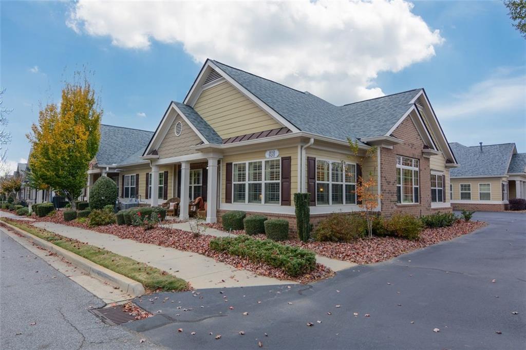 910 Brook Knoll Lane Cumming, GA 30041 - Photo 2 of 36 a front view of a house with a garden