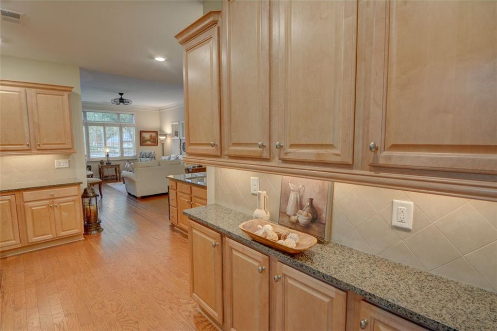 910 Brook Knoll Lane Cumming, GA 30041 - Photo 21 of 36 a kitchen with a sink and cabinets