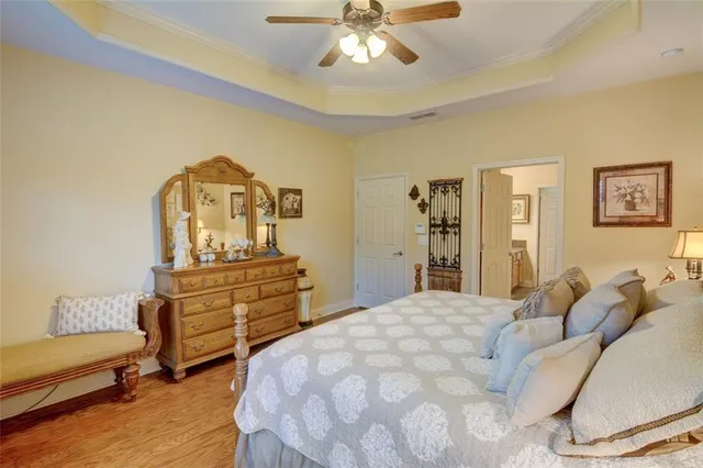 a bedroom with a bed and a dresser