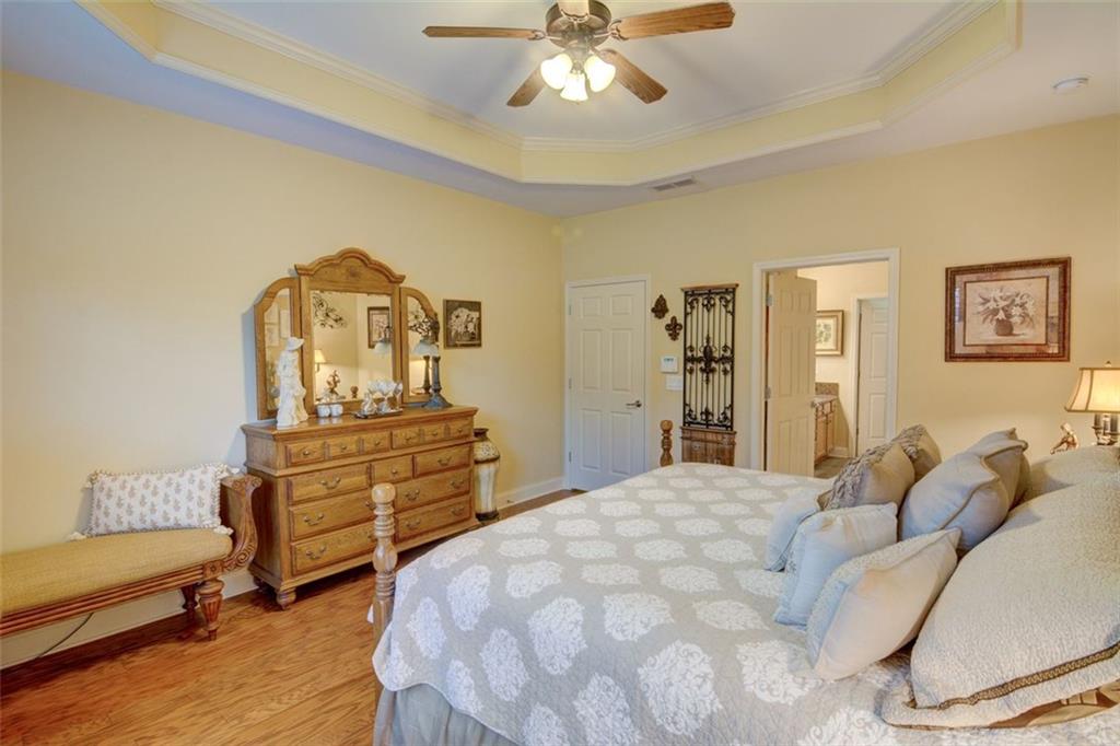 910 Brook Knoll Lane Cumming, GA 30041 - Photo 24 of 36 a bedroom with a bed and a dresser