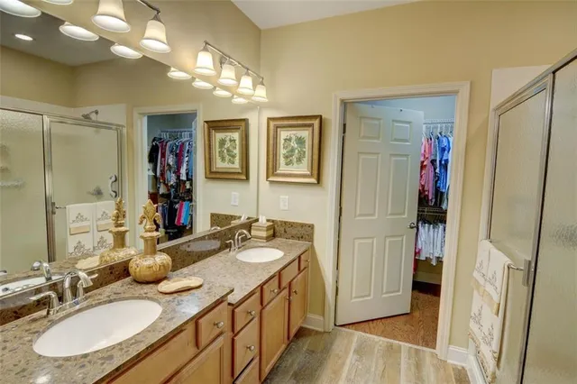 a spacious bathroom with a sink double vanity and a mirror