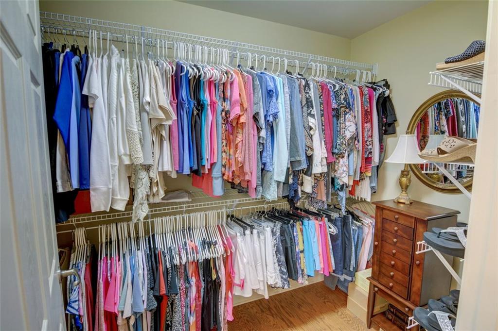 910 Brook Knoll Lane Cumming, GA 30041 - Photo 28 of 36 a view of walk in closet with clothes