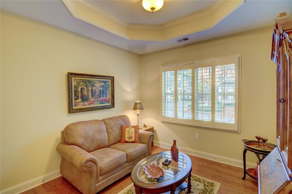 910 Brook Knoll Lane Cumming, GA 30041 - Photo 29 of 36 a living room with furniture and a window