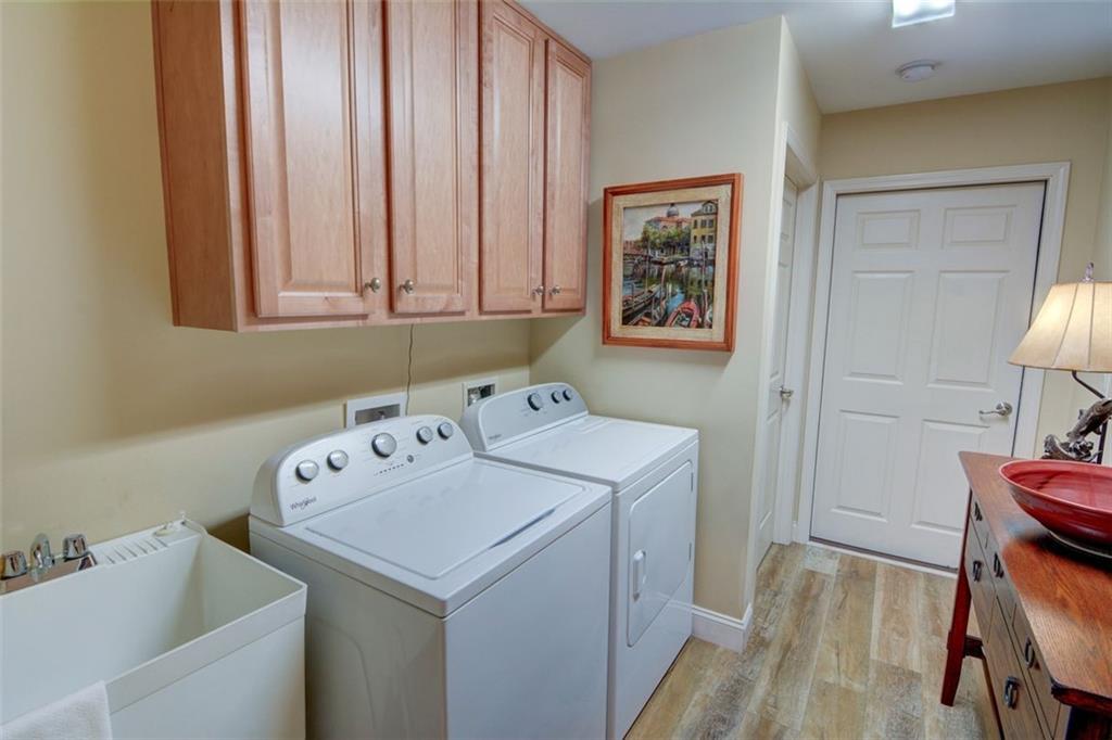 910 Brook Knoll Lane Cumming, GA 30041 - Photo 31 of 36 a utility room with dryer and washer