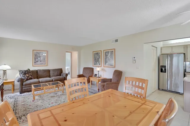 a living room with furniture and a lamp