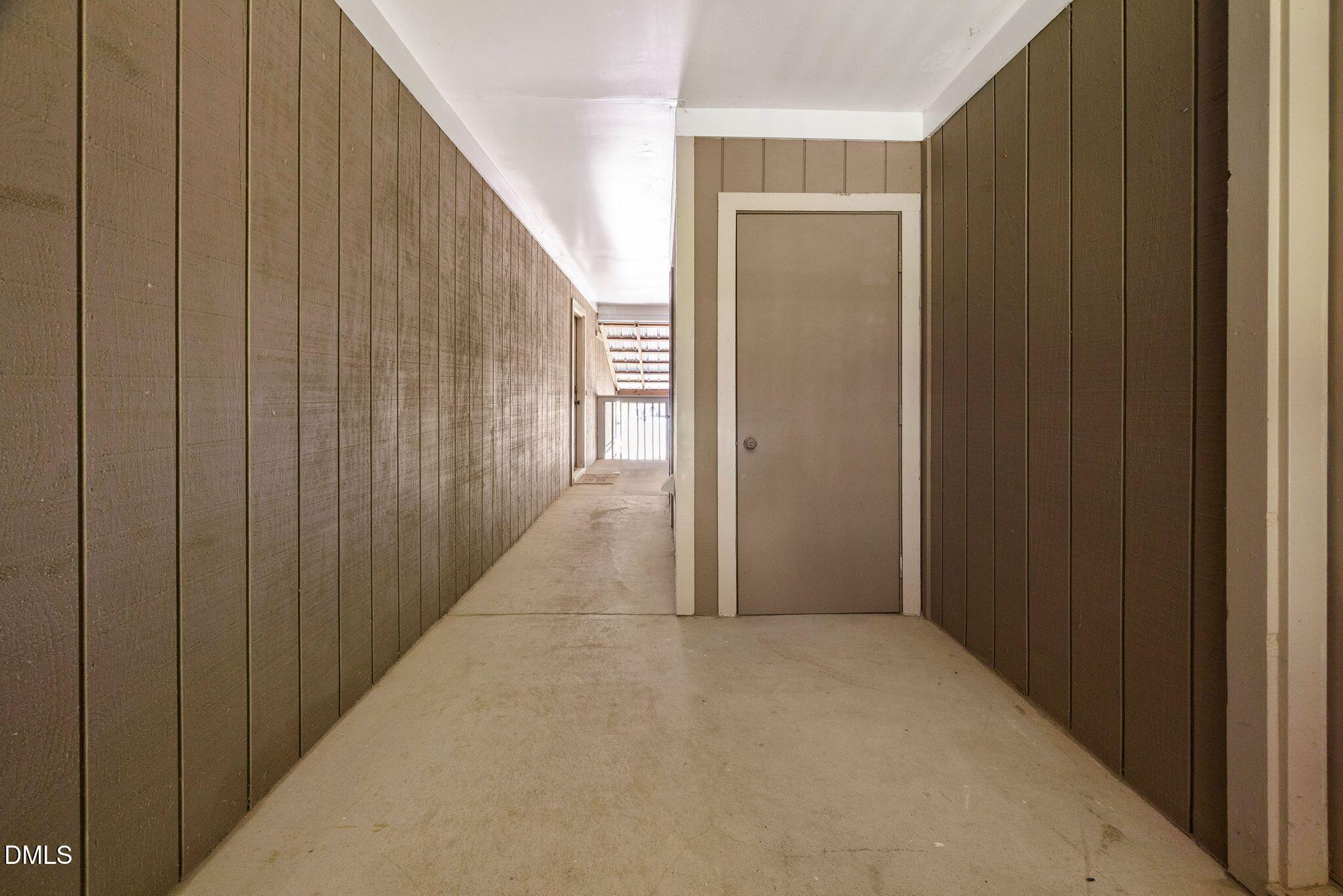3704 Chimney Ridge Place, Unit 207 Durham, NC 27713 - Photo 26 of 31 a view of a hallway with wooden walls