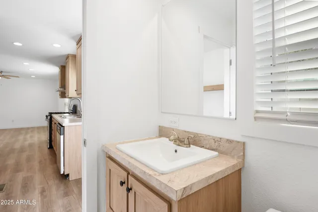 a bathroom with a sink and a mirror