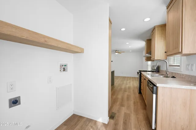 a kitchen with a sink and a refrigerator