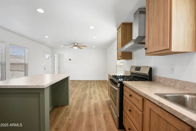 a kitchen with a sink appliances and cabinets