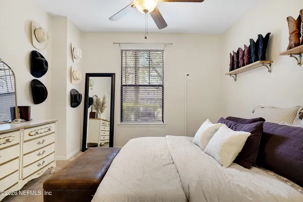 a bedroom with a bed and cabinets