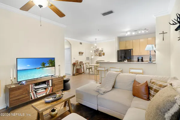 a living room with furniture and a flat screen tv