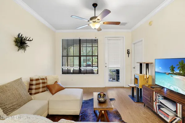a living room with furniture and a window