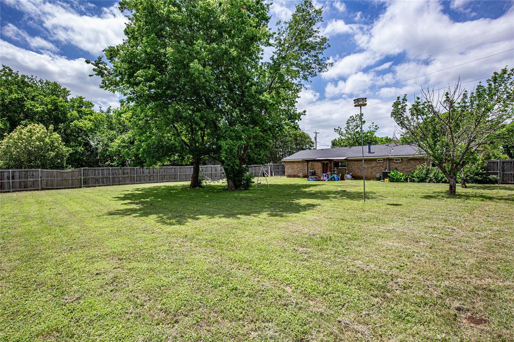 817 South Old Temple Road Lorena, TX 76655 - Photo 12 of 17 a view of yard with swimming pool and green space