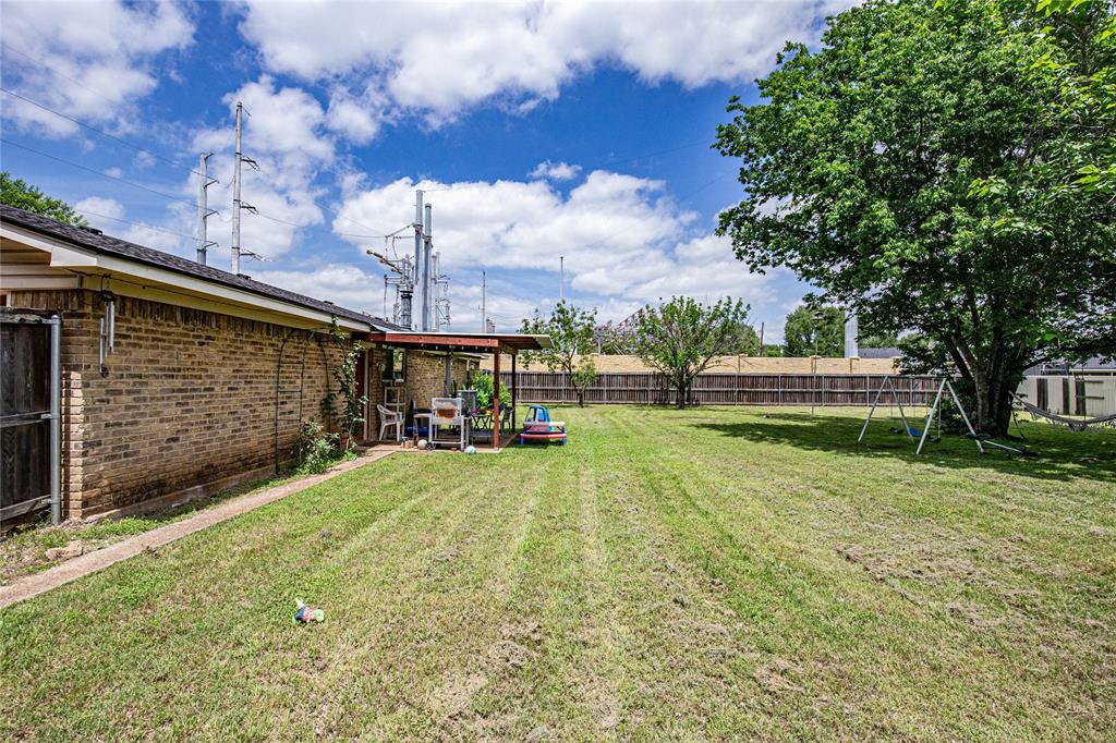817 South Old Temple Road Lorena, TX 76655 - Photo 13 of 17 a view of a back yard of the house with a large tree