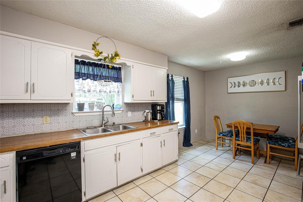 817 South Old Temple Road Lorena, TX 76655 - Photo 4 of 17 a kitchen with a sink and cabinets