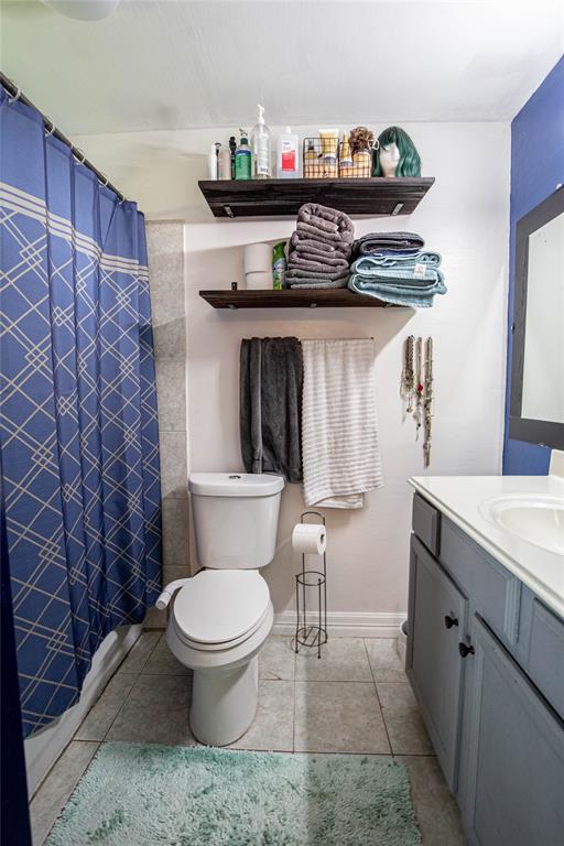 817 South Old Temple Road Lorena, TX 76655 - Photo 8 of 17 a bathroom with a granite countertop toilet and a sink