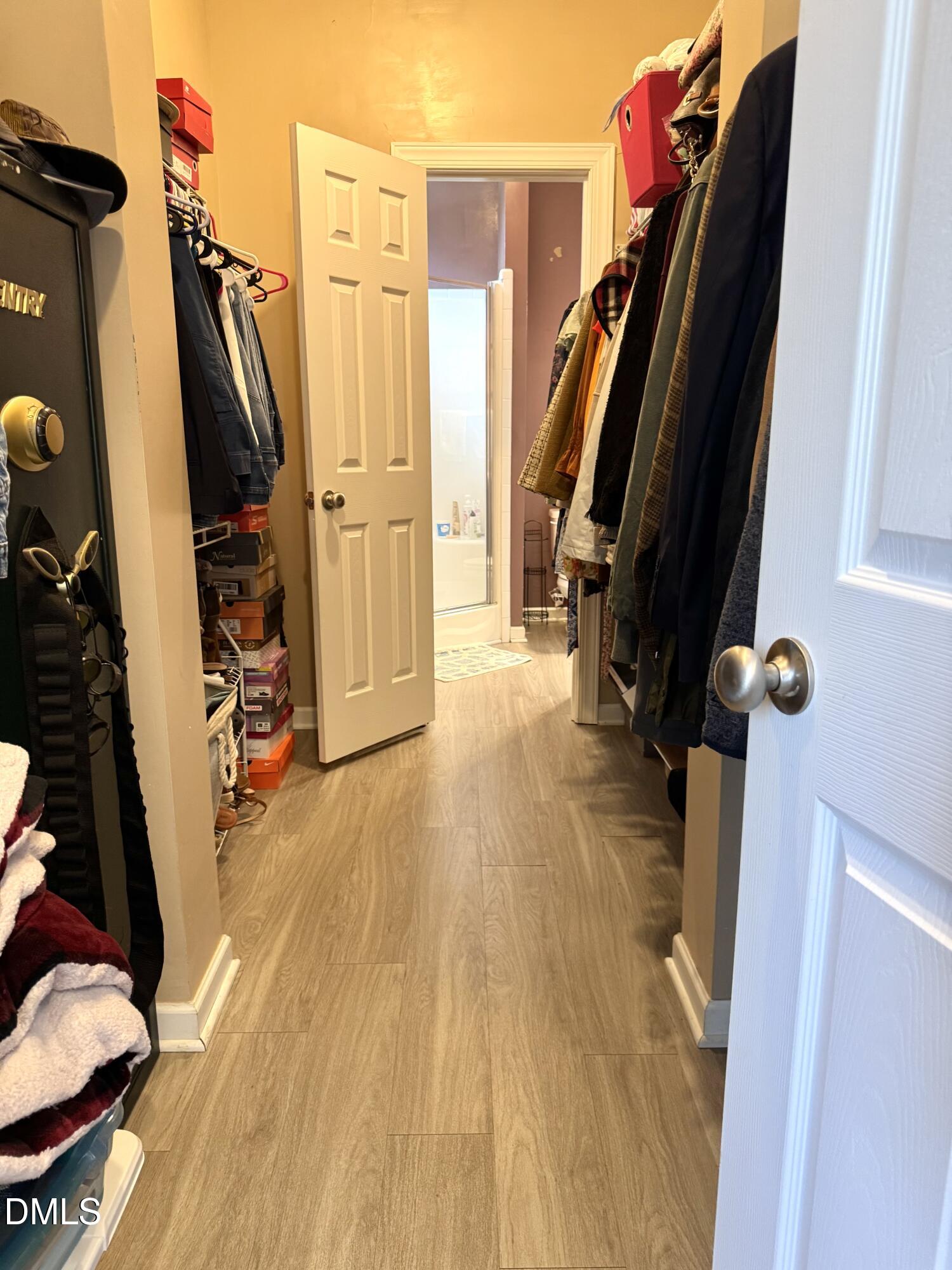640 Tart Town Road Dunn, NC 28334 - Photo 38 of 71 a view of walk in closet with clothes and shoes